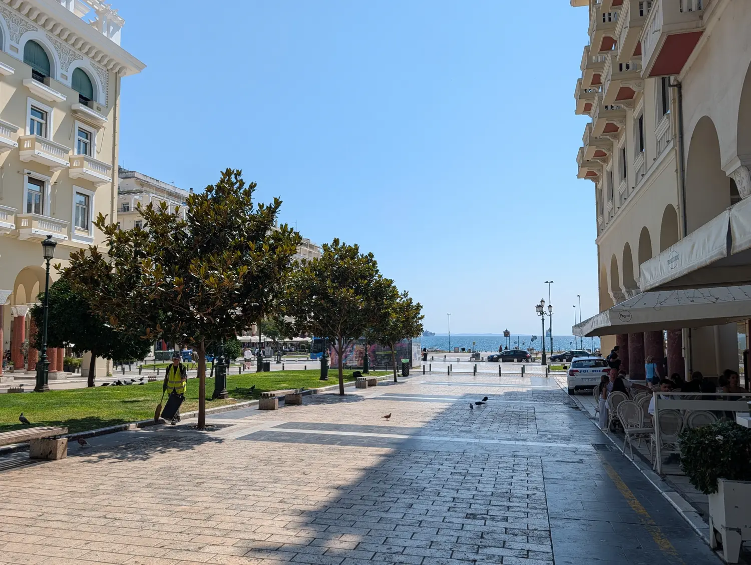 Aristotelous Square in Thessaloniki, its arcades and magnolia trees framing the sea at the end of the street